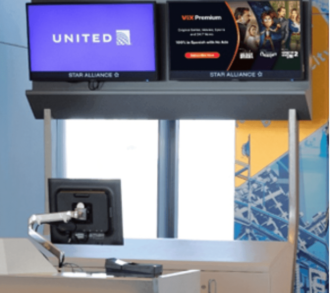 2 gate area displays showing a United Airline logo on the left monitor, and a ViX streaming service screen on the right monitor.